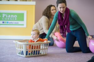 Photo-Kindermusik-Baby-mom-son-basket-ride-activity-play